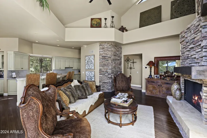 23 foot beamed ceilings with loads of windows and stone fireplace.
