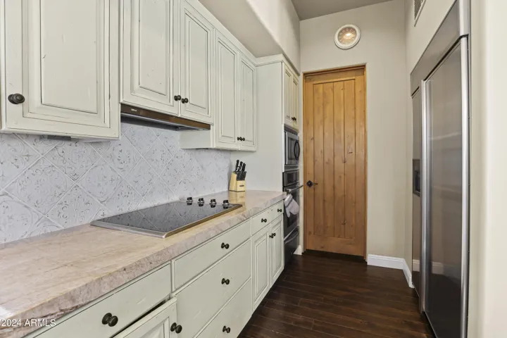 Great size walk in pantry, oversized built-in fridge, Viking electric cooktop.