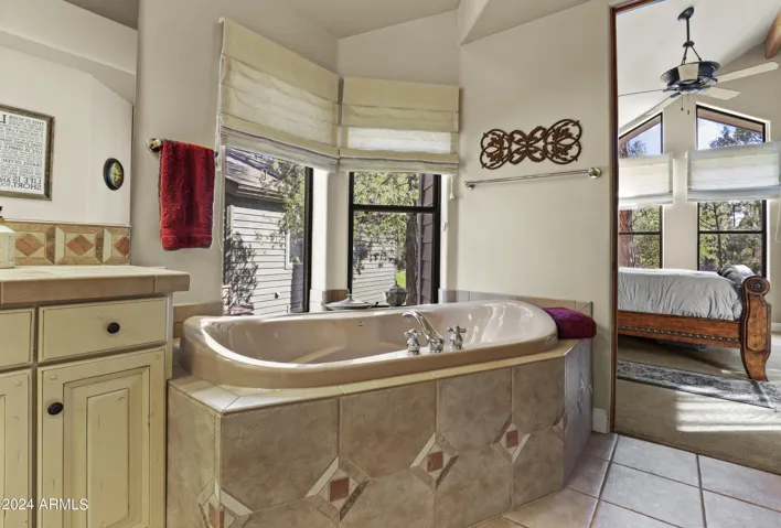 Master 1 soaking tub with views of golf course.