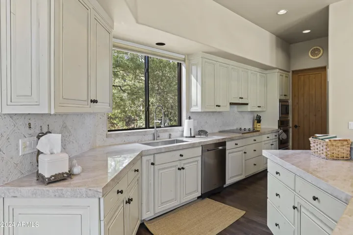 Kichen has loads of cabinets and walk in pantry, all newer appliances.