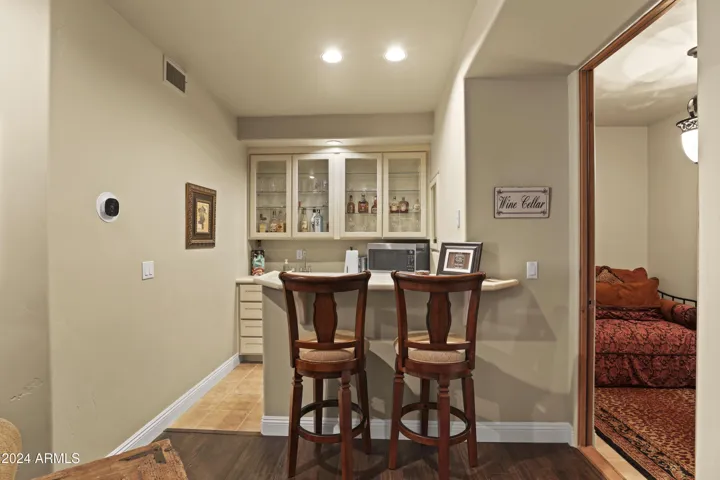 Belly on up to bar, with wine room.