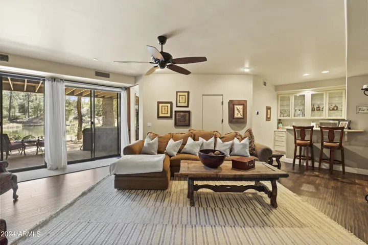 Lower gathering space has comfortable relaxing and bar space and views to adore.