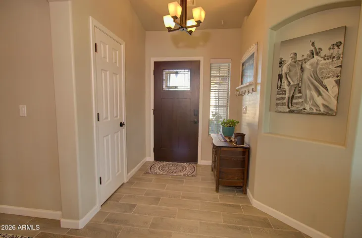 Nice wide entry with coat closet and rich finished door. Paint shown darker than is. See great room pics