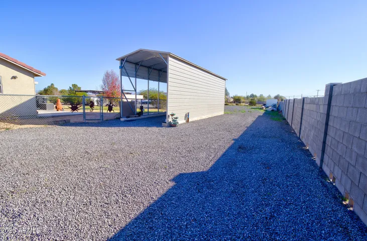 RV Shelter, access from front RV Gates. Pea gravel driveway
