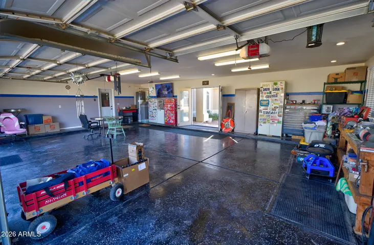 Epoxy floors, 2 openers, double doors to the front porch. Great for cross breeze when working/hanging out in the garage