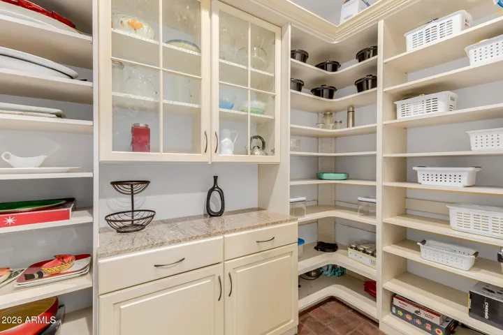 Spacious Pantry with Shelves and Cabinets.