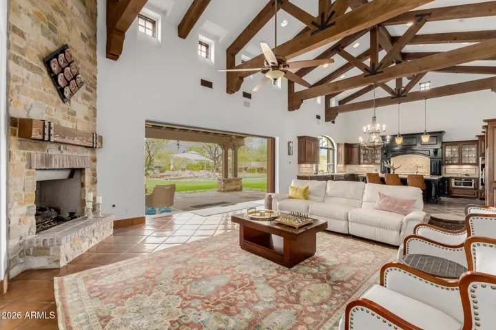 Exposed Ceiling, Timber Wood trusses and Large Doors Offering Backyard Views - A Room with Unique Character.