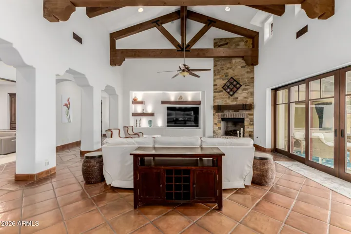 Family Room View from the Kitchen. Subtle Curved Arches Separates the Corridor for an Open Look.