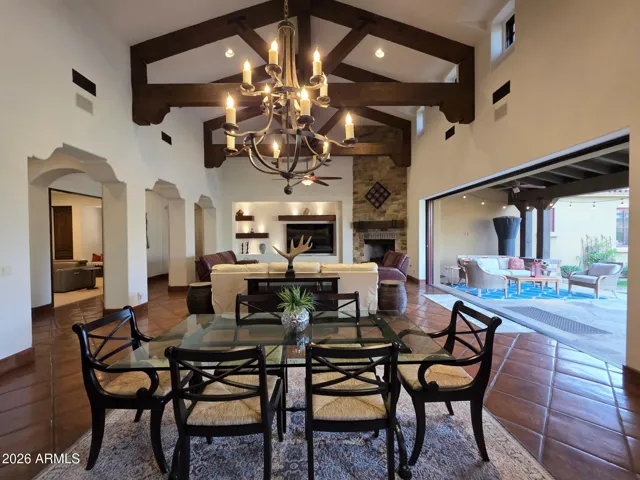 Oversized Great Room Highlighted by Extensive Timber Wood Trusses & Chandelier!