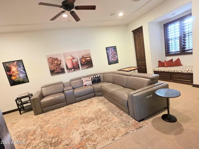 Media Room with Ample Seating Space, Bench, & Window with Plantation Shuters.
