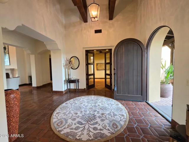 Dramatic Foyer with Architectural Beam Detail & Authentic Saltillo Tiles.