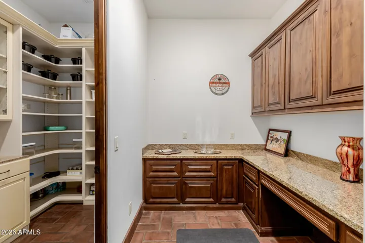 A Tech Space that converts to any space you want it to be! Granite Counter and Cabinets Galore!