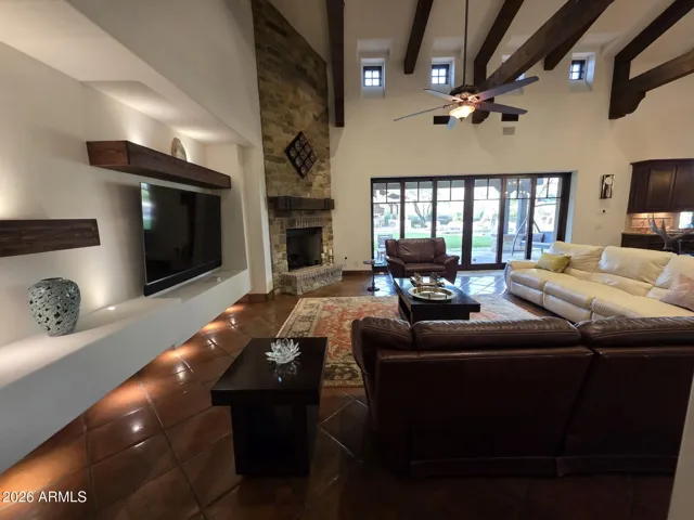 Tall Brick Facade Fireplace! Notice the Long Window Pane Style Patio Door.