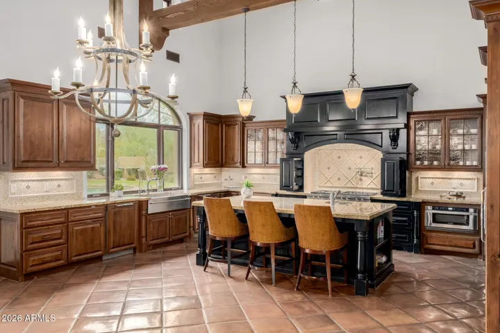 Furniture Kitchen Center Island : Granite Counter Top- wood trim and shelves on either sides.