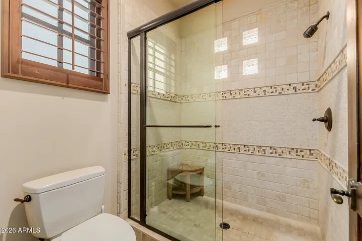 Guest Shower Stall with all the decorative Wall Tile and Flooring details.