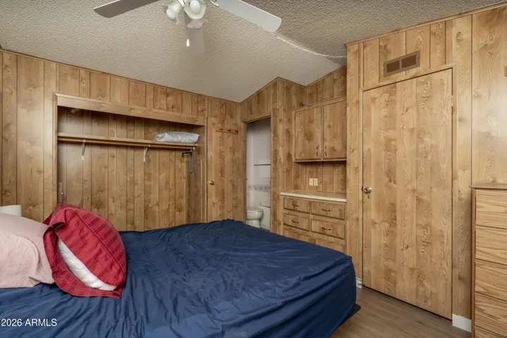 Bedroom with built in closet and dresser