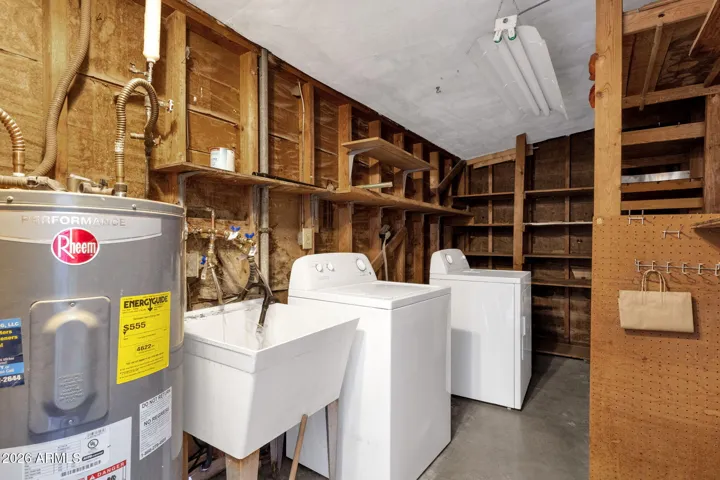 Washer Dryer in shed with sink