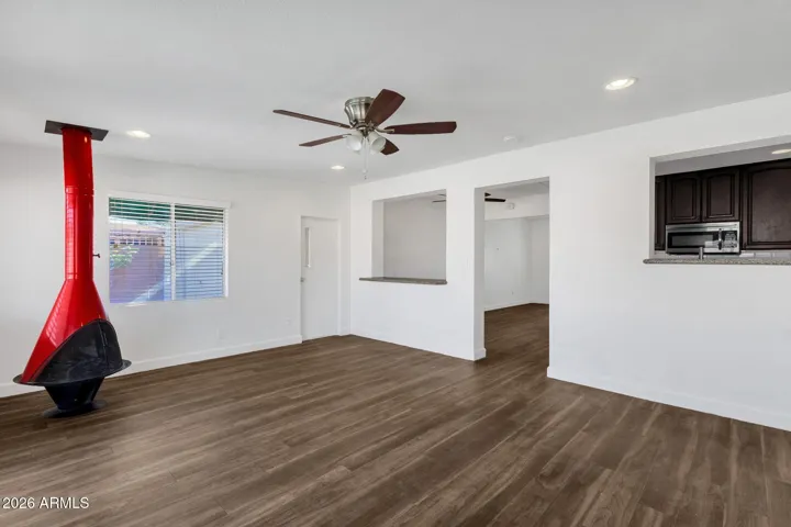 Bonus room looks into kitchen and dining room