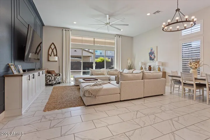 An open living space with comfortable proportions and easy connection to the kitchen and dining areas.