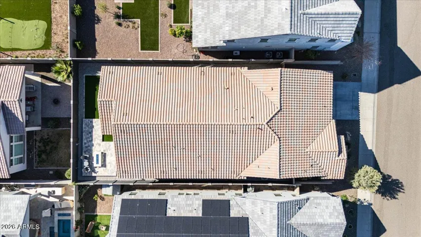 Aerial view highlighting the home’s footprint, backyard layout, and position within the surrounding neighborhood.