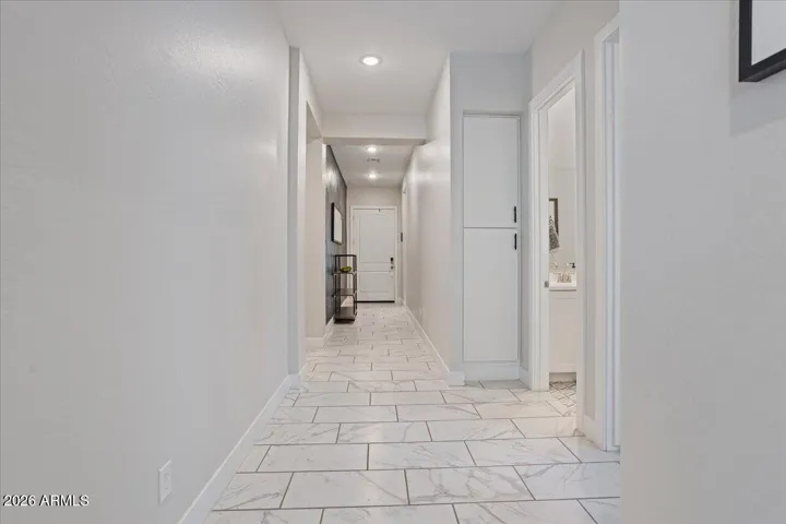 A welcoming interior view highlighting the home’s clean lines and natural flow from the front entry.