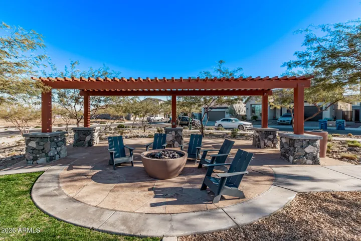 A community fire pit and seating area offering a relaxing outdoor gathering space.