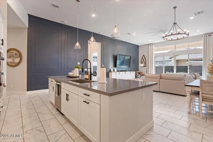 Generous counter space and a central island designed for both cooking and gathering.