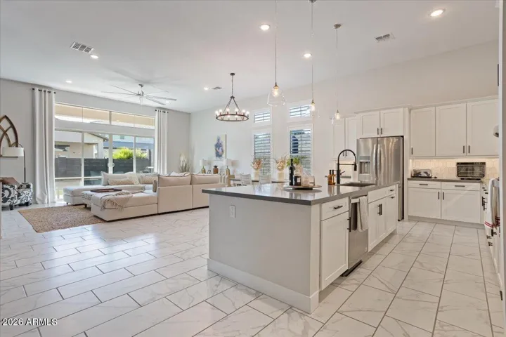 An open great room with abundant natural light and an easy flow for everyday living and entertaining