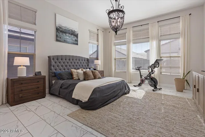 A spacious and serene primary suite designed for comfort and relaxation.