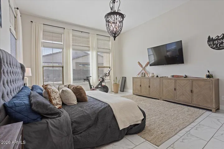 Room for a sitting area or media setup, offering added flexibility within the primary suite.