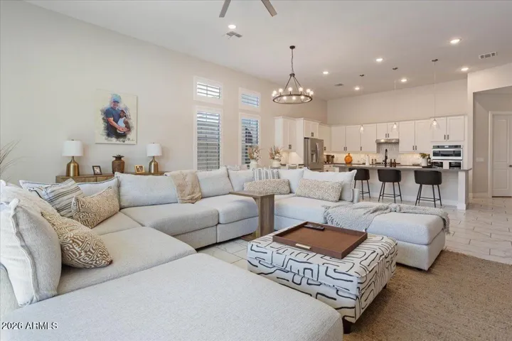 Light-filled and welcoming, this great room offers flexibility for relaxing or entertaining.