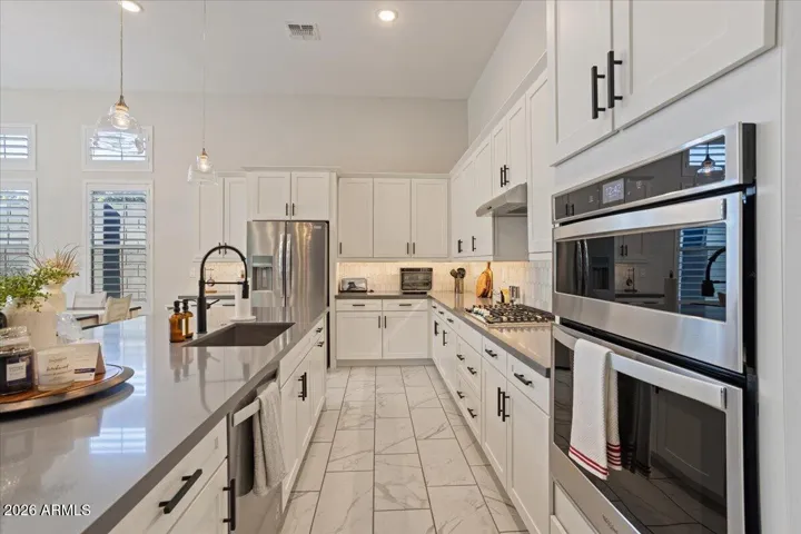 A full view of the kitchen showcasing ample cabinetry, counter space, and thoughtful flow.