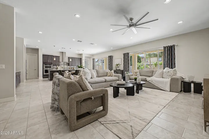 great room features tons of light and two massive sliders for entertaining or a more spacious feel