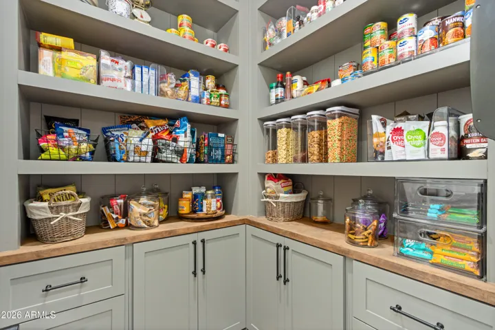 The Walk-In Pantry Sits Across From A Beverage Center