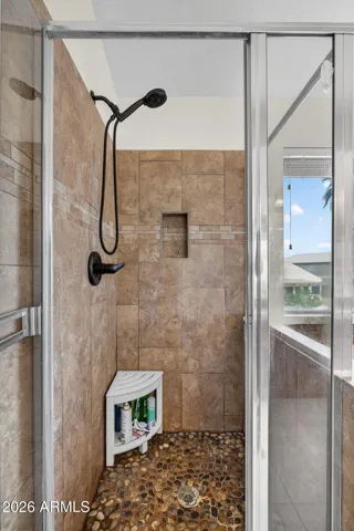 Primary shower with stone tile