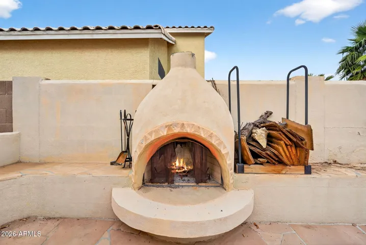 Kiva adobe style built in outdoor fireplace