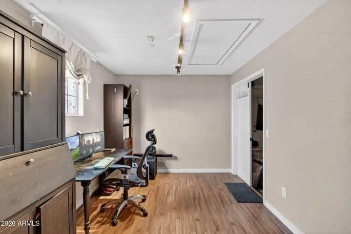 Flex space in 3rd car garage used for office, has window and private entrance and HVAC. Could be used for guest quarters, multi gen living, office, gym or be converted back to 3rd car garage.