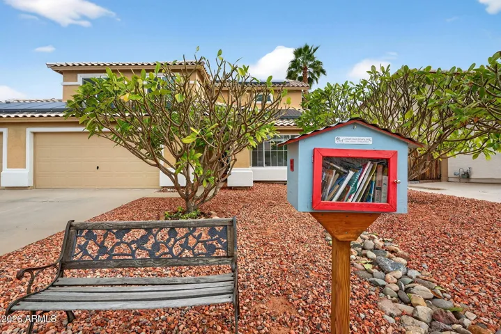 Little library and bench seating out front
