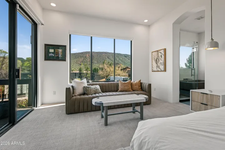 Spacious Sanctuary: This expansive suite offers ample room for relaxation, including a dedicated seating area perfect for unwinding at the end of the day.