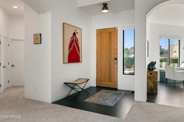 Curated Foyer: The home makes a striking first impression with a dedicated foyer featuring striking art décor, setting a refined and welcoming tone the moment you step through the door.