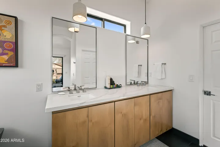 Refined Functionality: The suite features a sophisticated double sink vanity with a clean, modern design, providing ample space and personal convenience for your morning and evening routines.