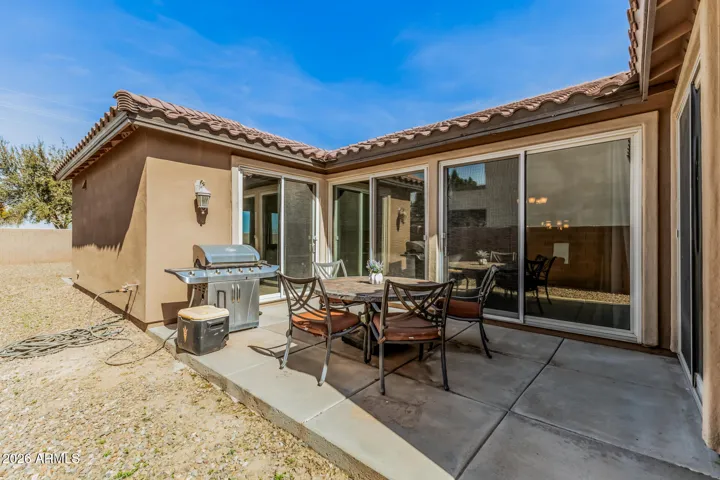 Side patio off kitchen/dining/living