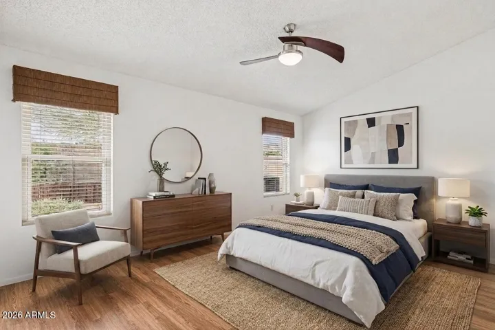 Owner's suite with vaulted ceiling (virtually staged)