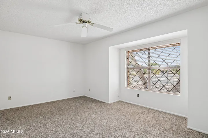 Bedroom 2 with new carpet and bumped out window