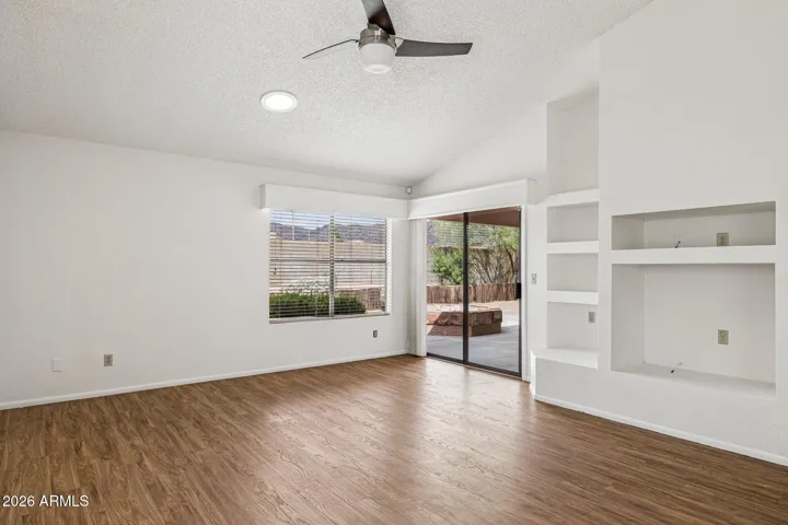 Vaulted family room with kitchen access plus back patio slider