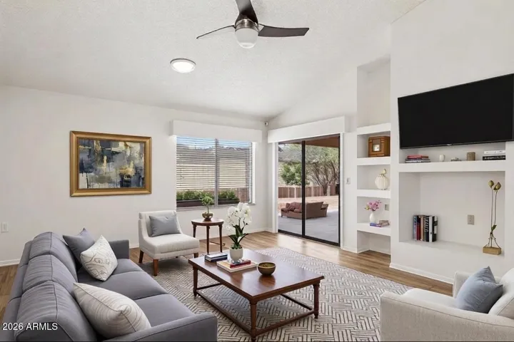 Vaulted family room with kitchen access plus back patio slider (virtually staged)