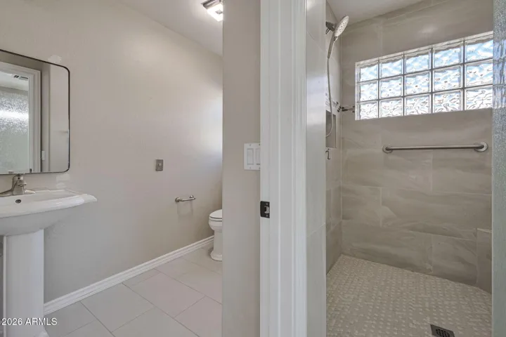 Primary Bathroom with Huge tiled shower and separate toilet room/sink