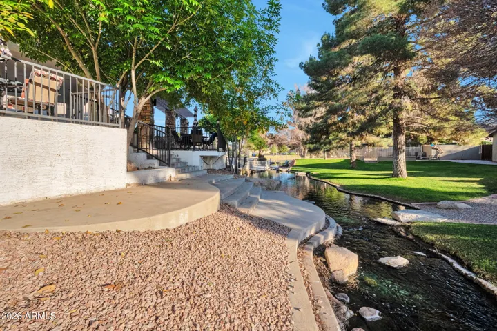 Backyard sitting area by water