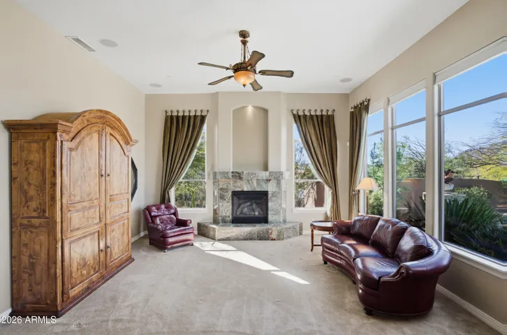 Light Filled Family Room features a gas fireplace.