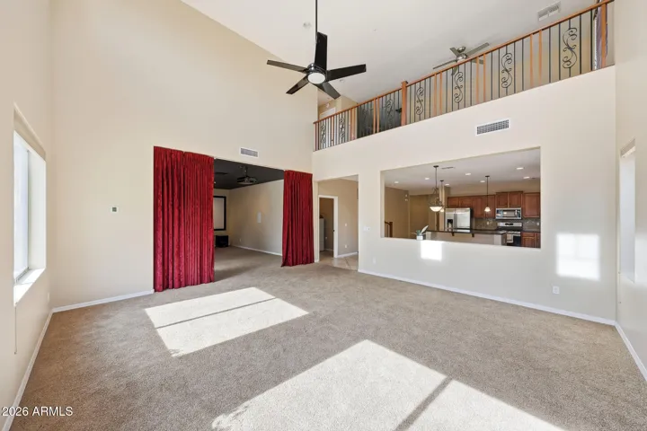 Family room area looking towards Home theatre room & upstairs loft
